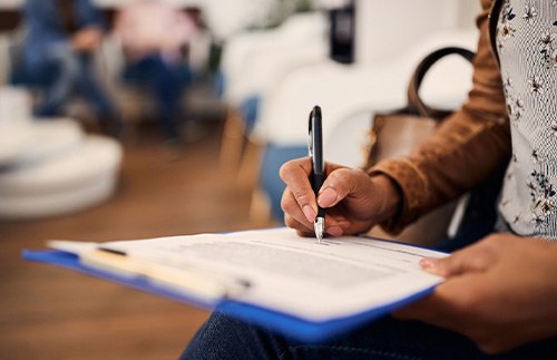 Patient filling out form in lobby