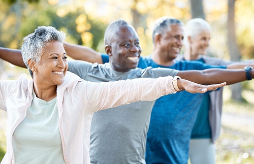 Adults smiling in workout class