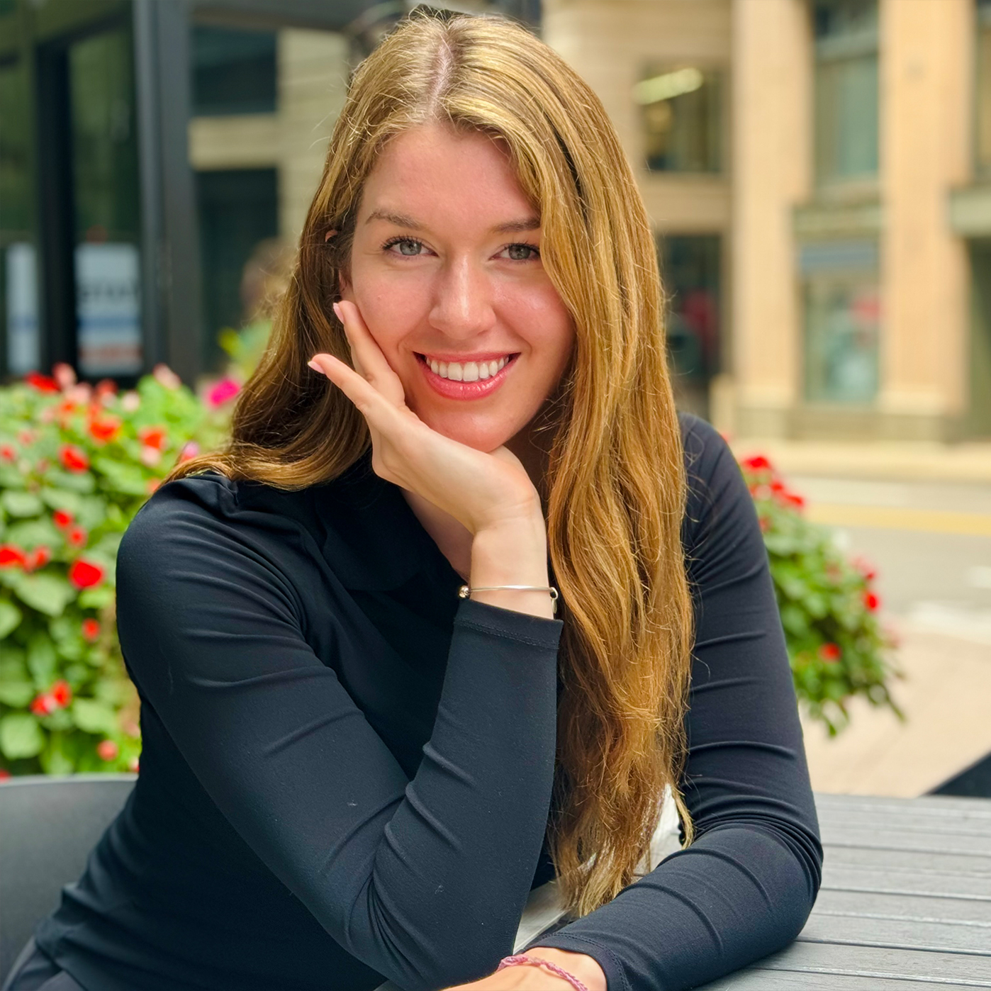 Woman being color matched for veneers in Boston