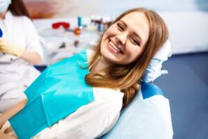 Woman smiling before her dental implant surgery