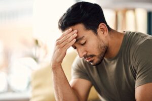 sad man sitting on the couch